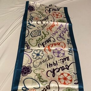 Coach Script and Floral Pattern Scarf with Teal Trim. Scarf is 100% silk